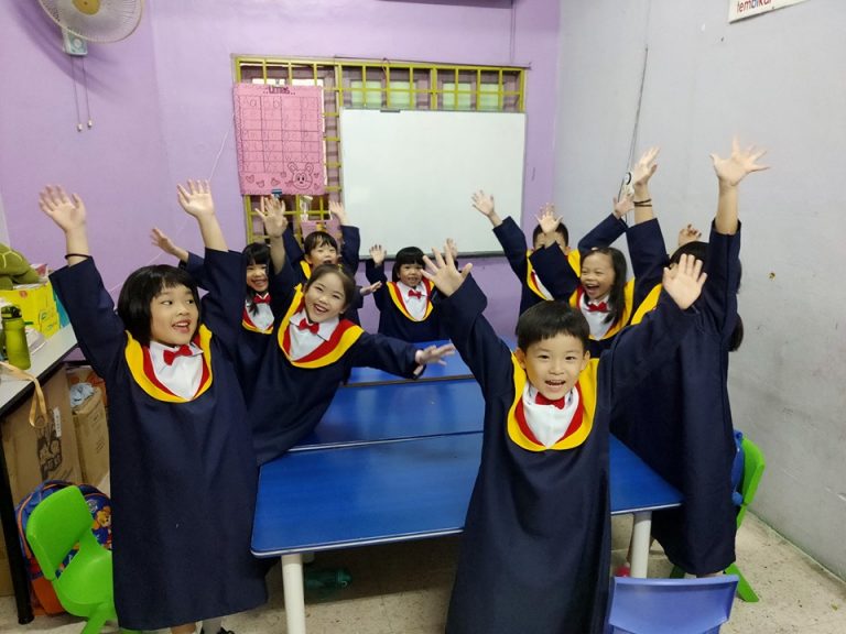 child graduation waving